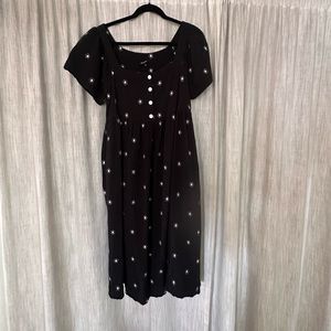 Maxwell black dress with embroidered flowers.